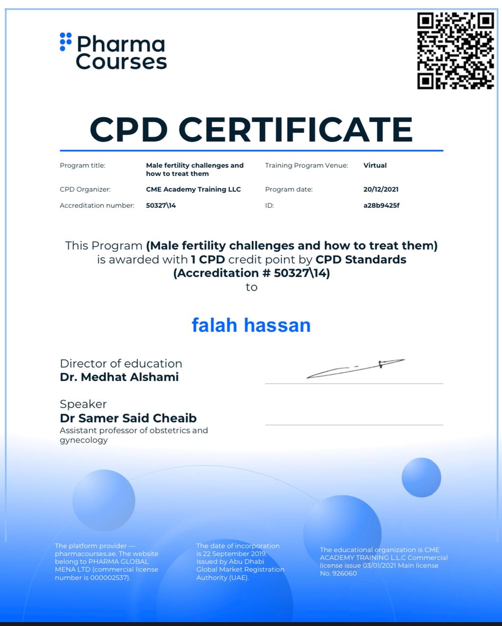 A faculty member at the College of Pharmacy receives a certificate of participation in an international workshop on male infertility